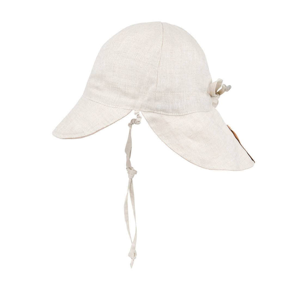 Beige sun hat with a tie on a white background