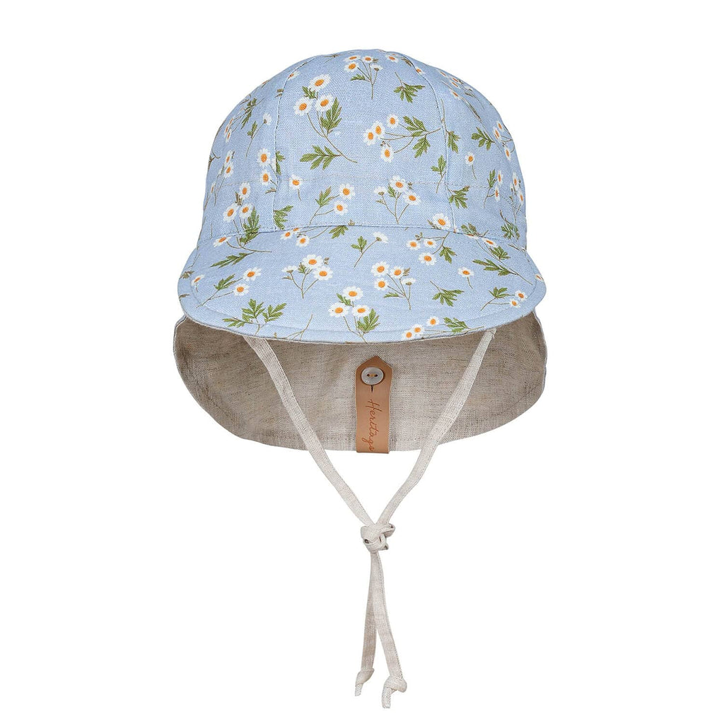 Floral patterned sun hat with beige brim on a white background
