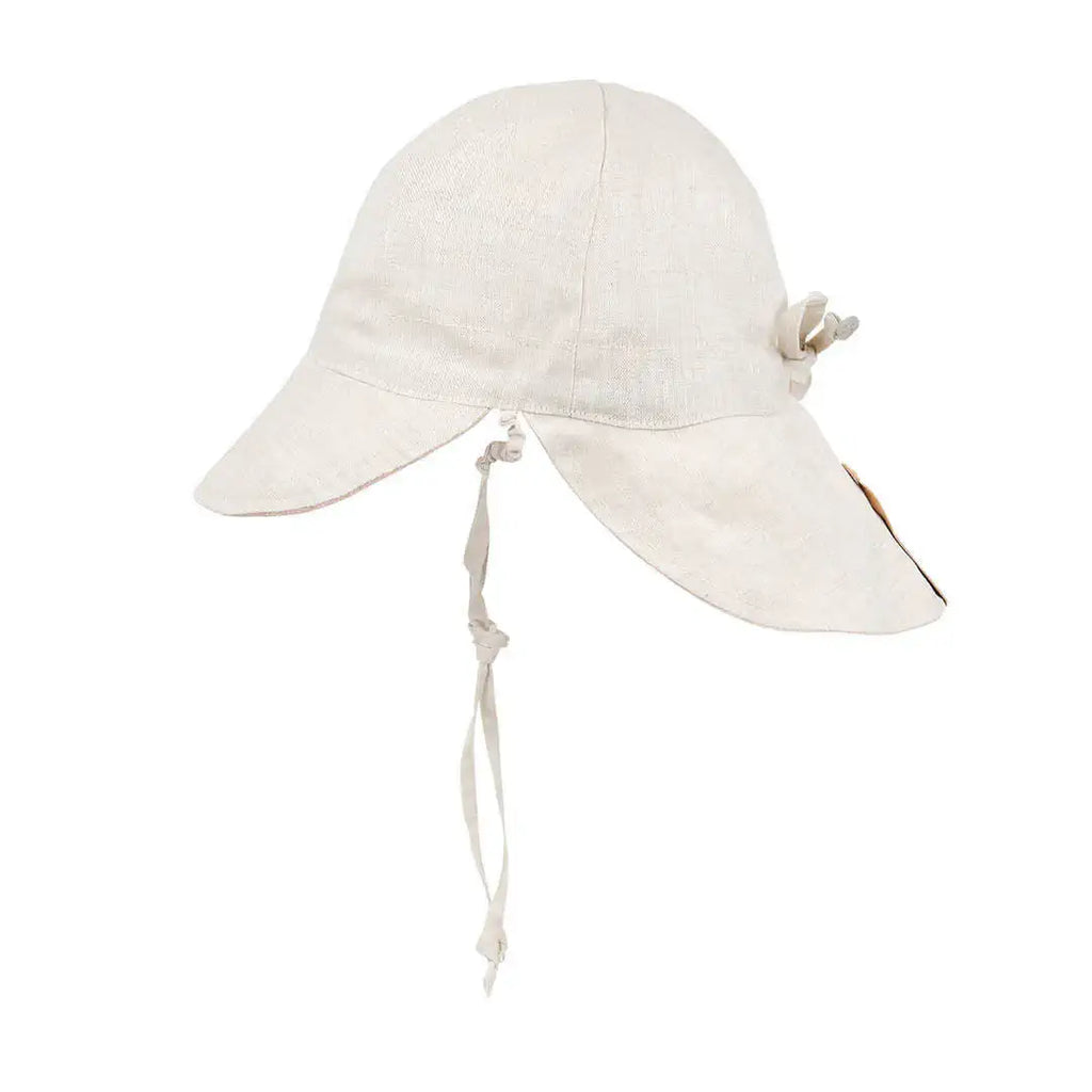 White sun hat with a chin strap on a white background