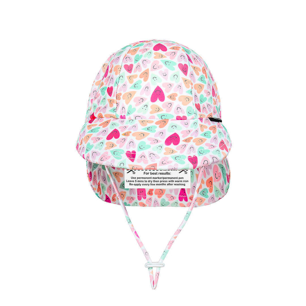 Colorful heart-patterned sun hat with a strap on a white background