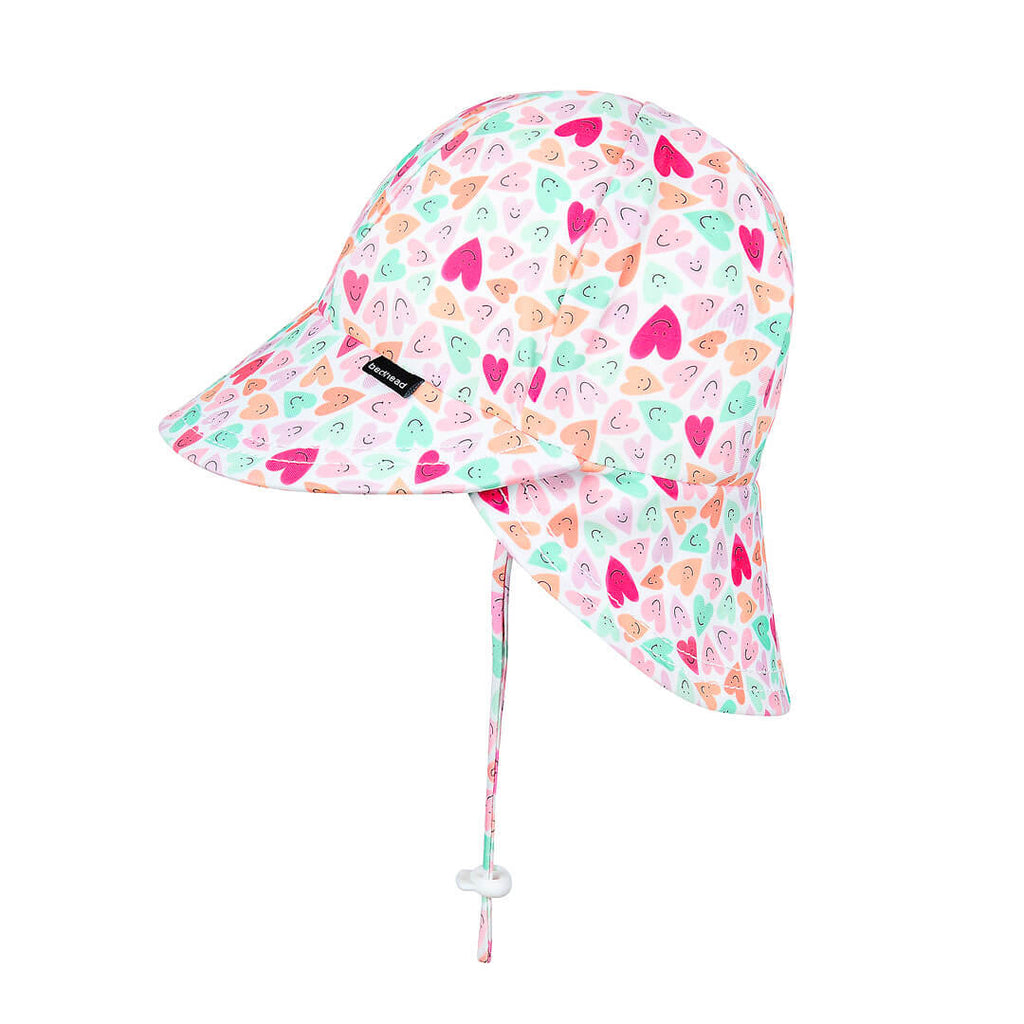 Children's sun hat with colorful heart pattern on a white background