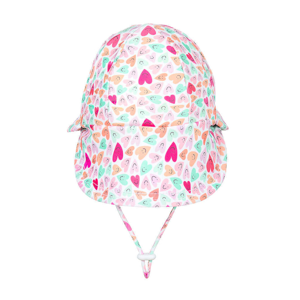 Colorful heart-patterned sun hat on a white background