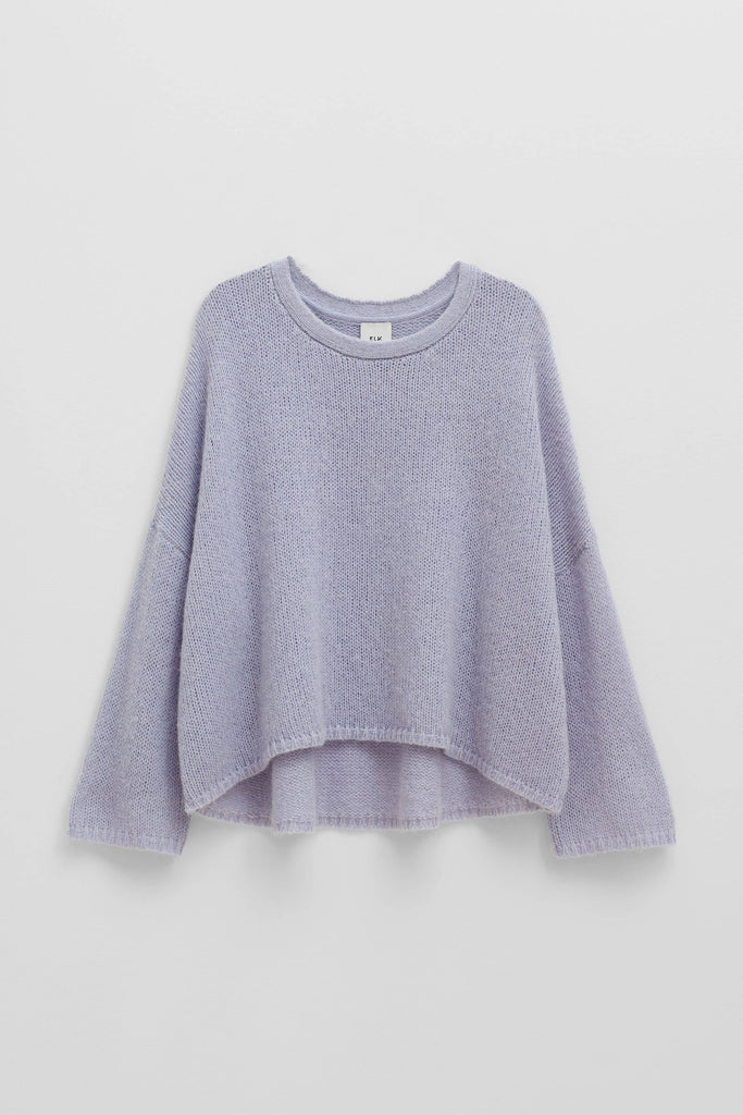 Light purple sweater on a light gray background