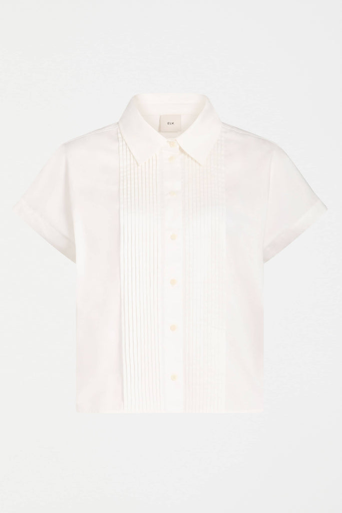 White shirt with subtle pattern on a light gray background