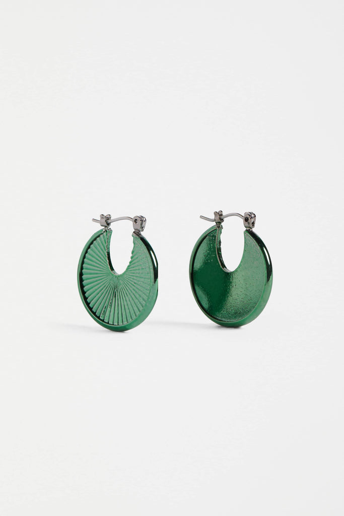 Green hoop earrings on a white background