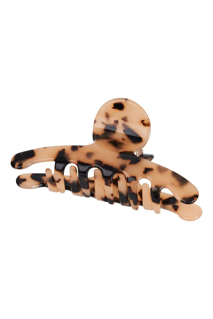 Tortoiseshell patterned hair clip on a white background