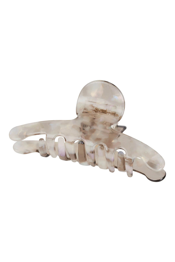Clear plastic hair clip on a white background