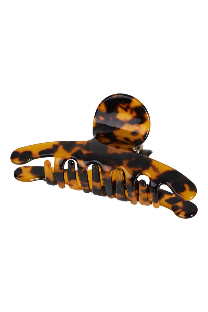 Tortoiseshell patterned hair clip on a white background