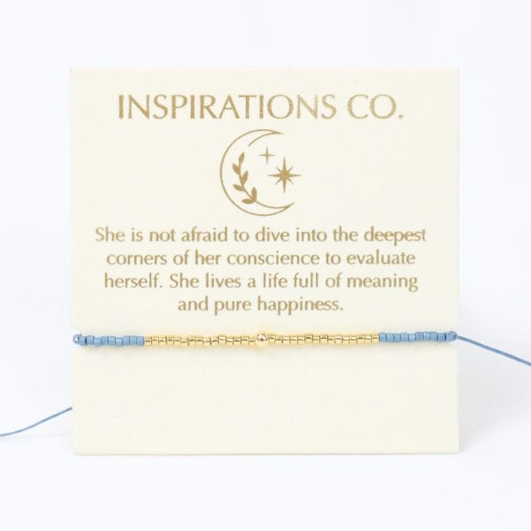 Inspirational card with text and a bracelet on a white background, featuring the 'Inspirations Co.' brand.