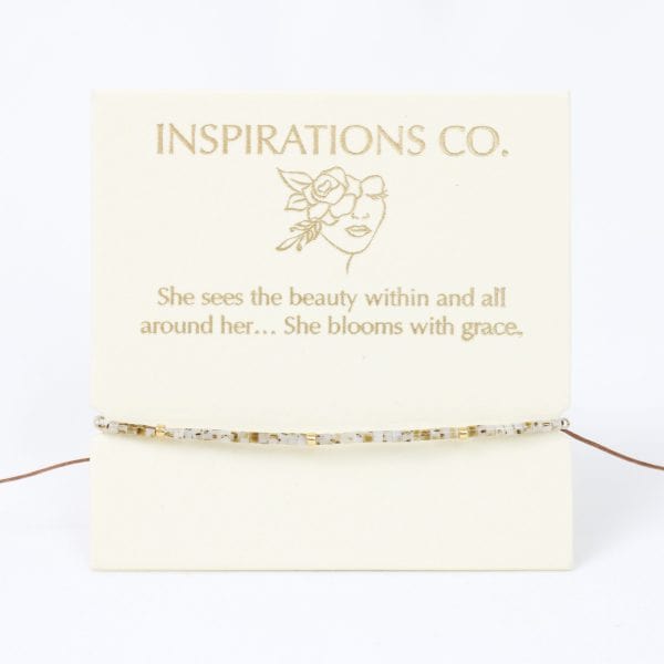 Jewelry card with 'Inspirations Co.' branding and a quote on a white background