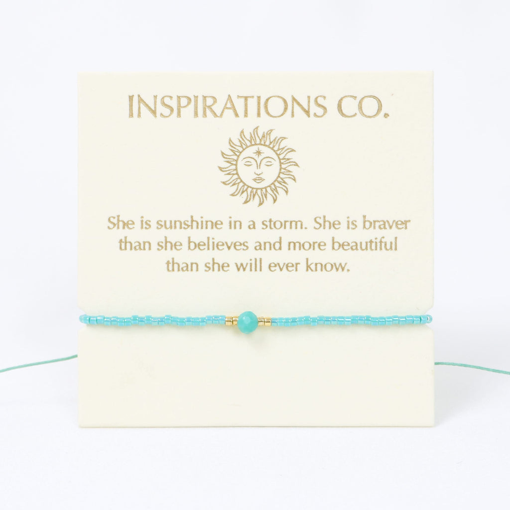 Turquoise bracelet with a quote card from Inspirations Co. on a white background