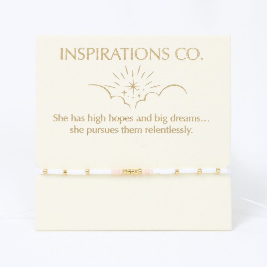 Card with 'Inspirations Co.' text and motivational quote on a white background