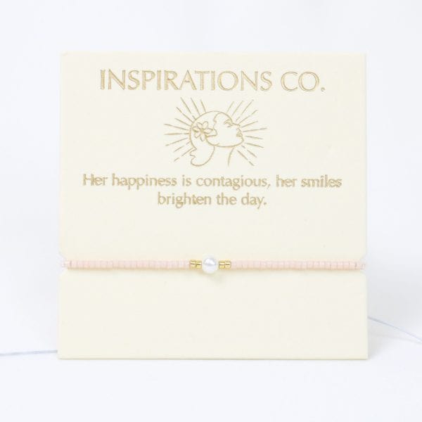 Pearl bracelet in a 'Inspirations Co.' box with a quote on a white background