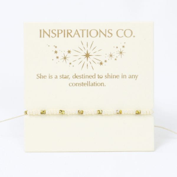 Bracelet on a card with 'Inspirations Co.' text and star design