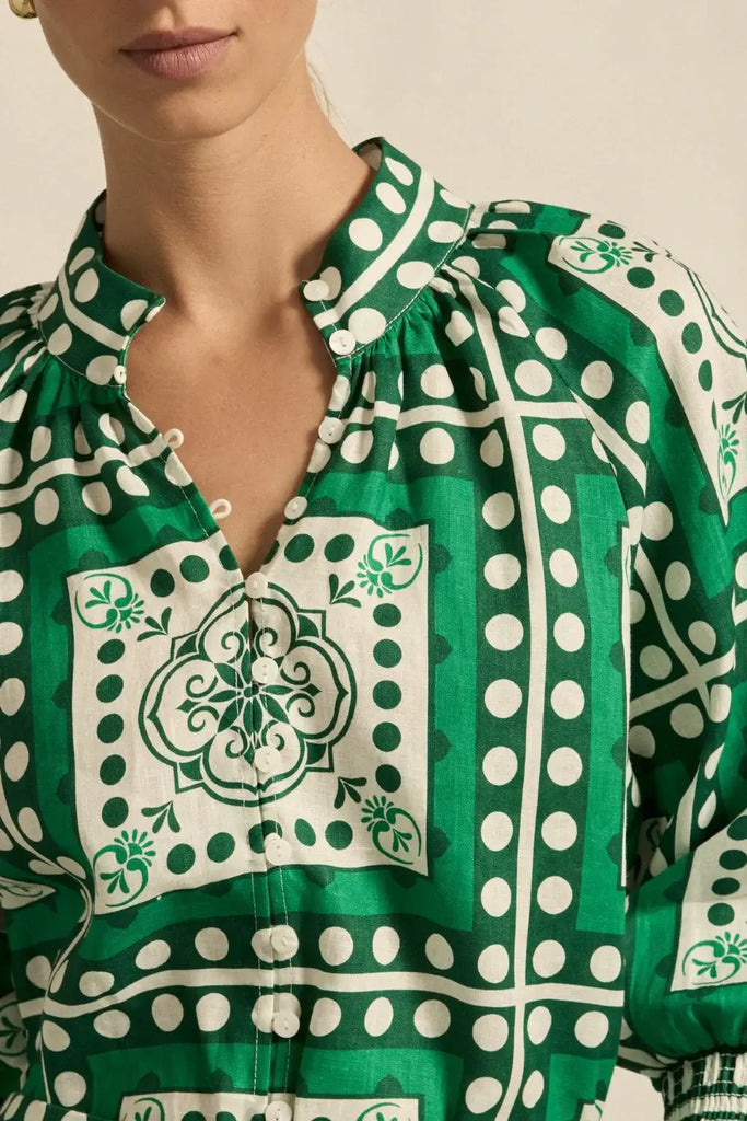 Green and white patterned blouse with a close-up of the neckline.