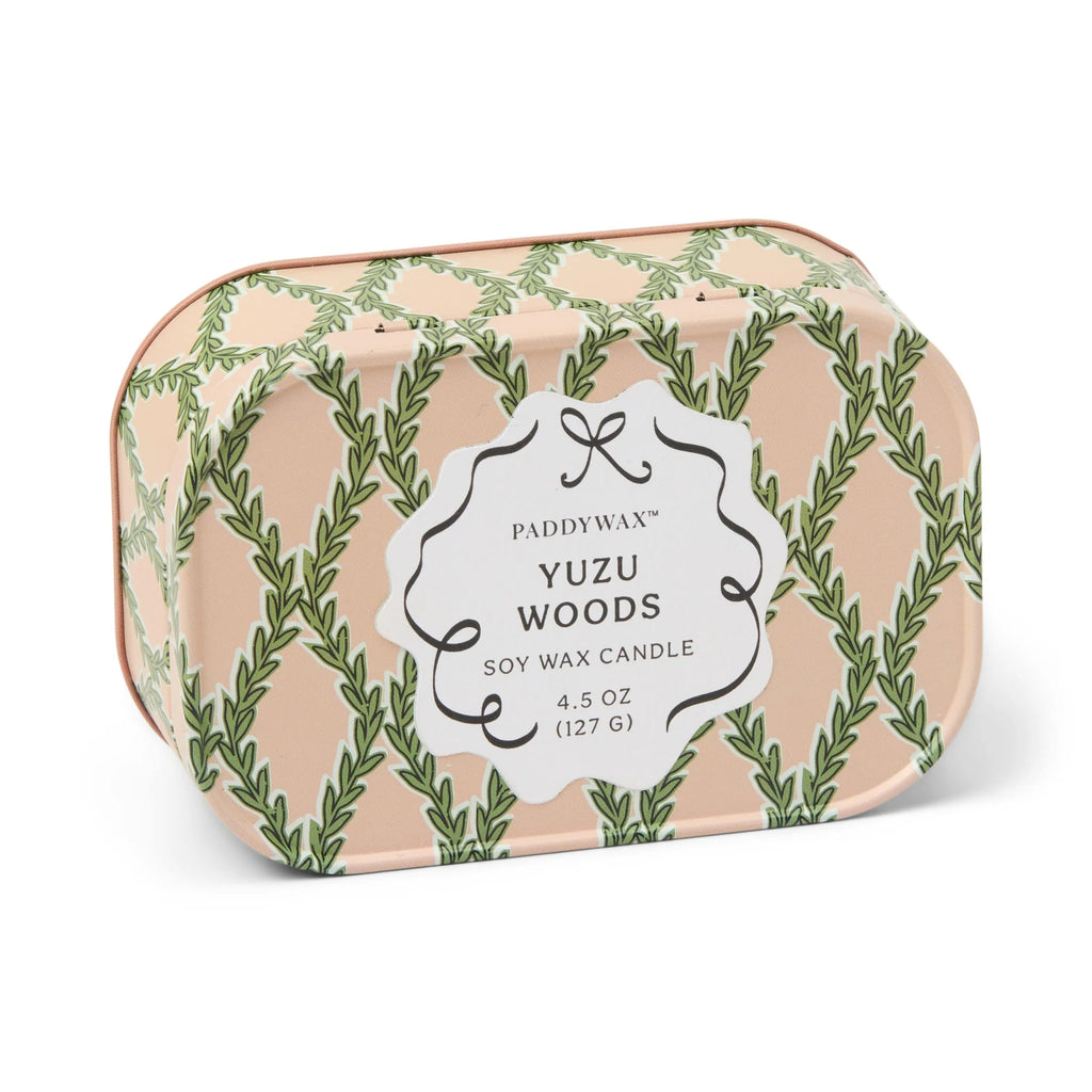 Paddywax Yuzu Woods candle packaging with leaf pattern on a white background
