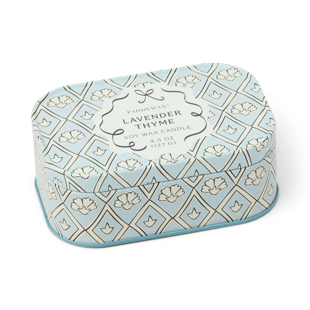 Heart-shaped lavender thyme candle tin with decorative pattern on a white background