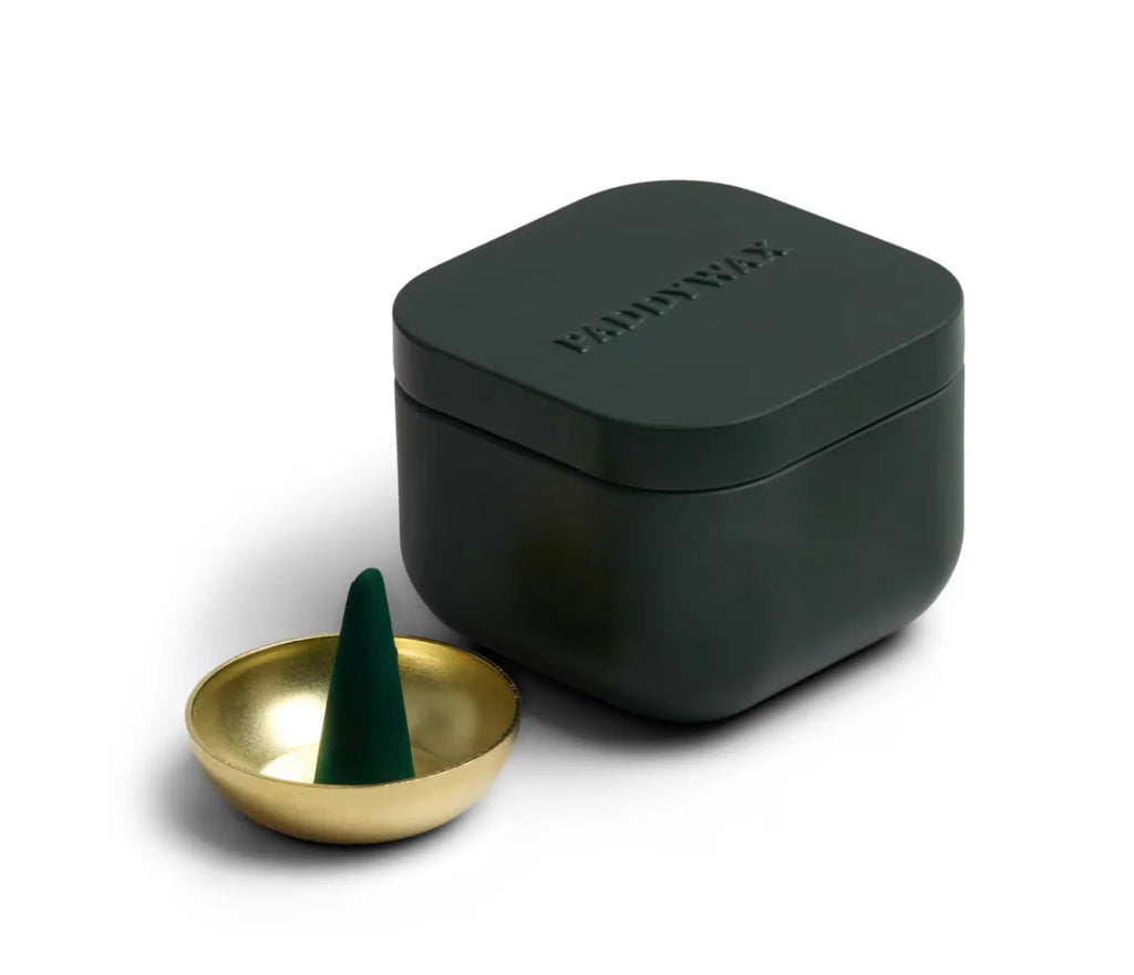 Dark green container with a gold dish and green cone on a white background