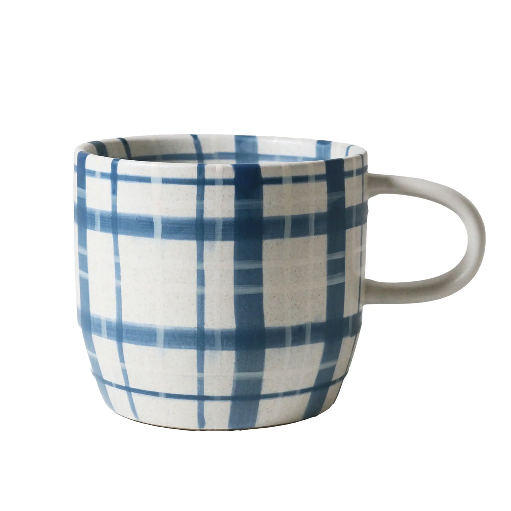 Mug with blue and white plaid pattern on a white background