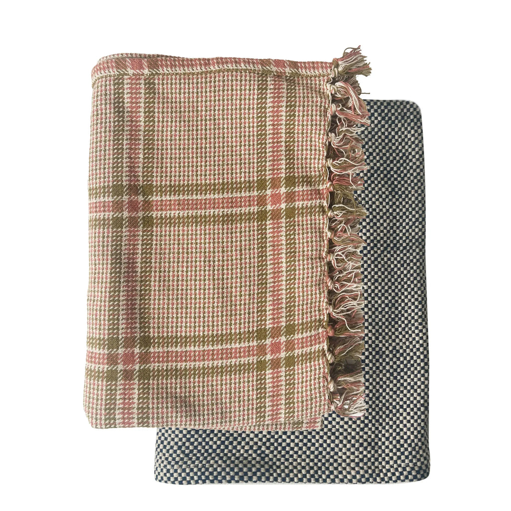 Two woven blankets with plaid and checkered patterns on a white background