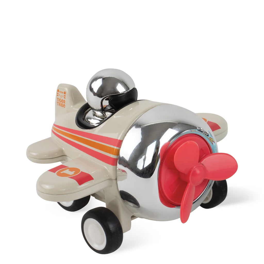 Toy airplane with a red propeller on a white background