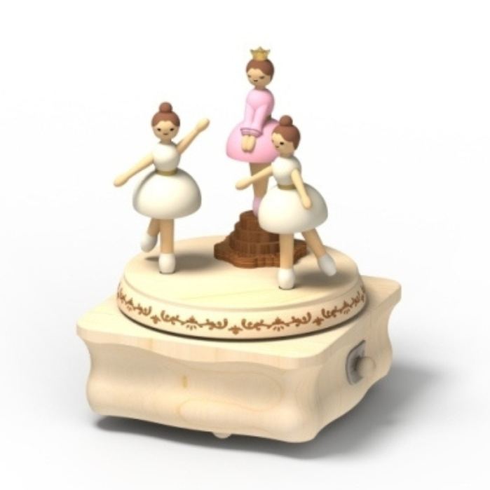Wooden music box with ballerina figurines on a white background