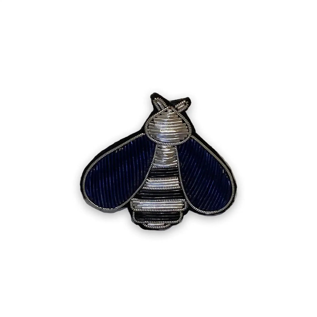 Decorative moths with black and silver pattern on a white background