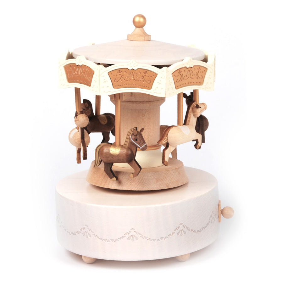 Wooden carousel toy with horses on a white background