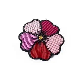 Floral patch with pink and red petals on a white background
