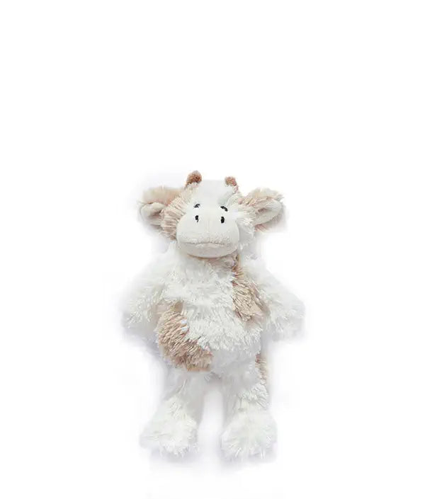 Plush cow toy on a white background