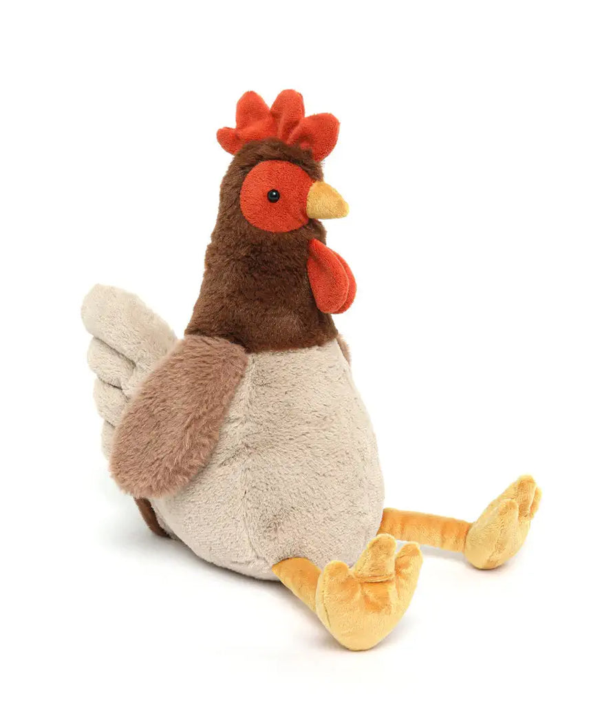 Plush toy rooster on a white background