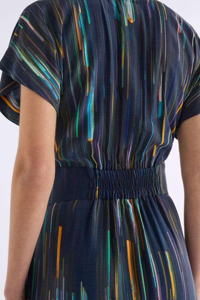 Navy dress with multicolored abstract pattern on a white background